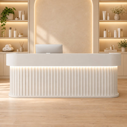 White curved reception desk in a beauty salon reception area
