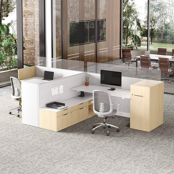 Modern office setup with desks, chairs, and a large window view.