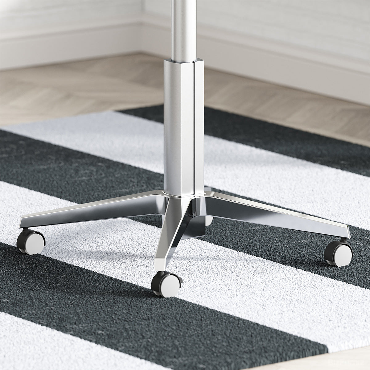 Close-Up View of Desk Base with Locking Caster Wheels